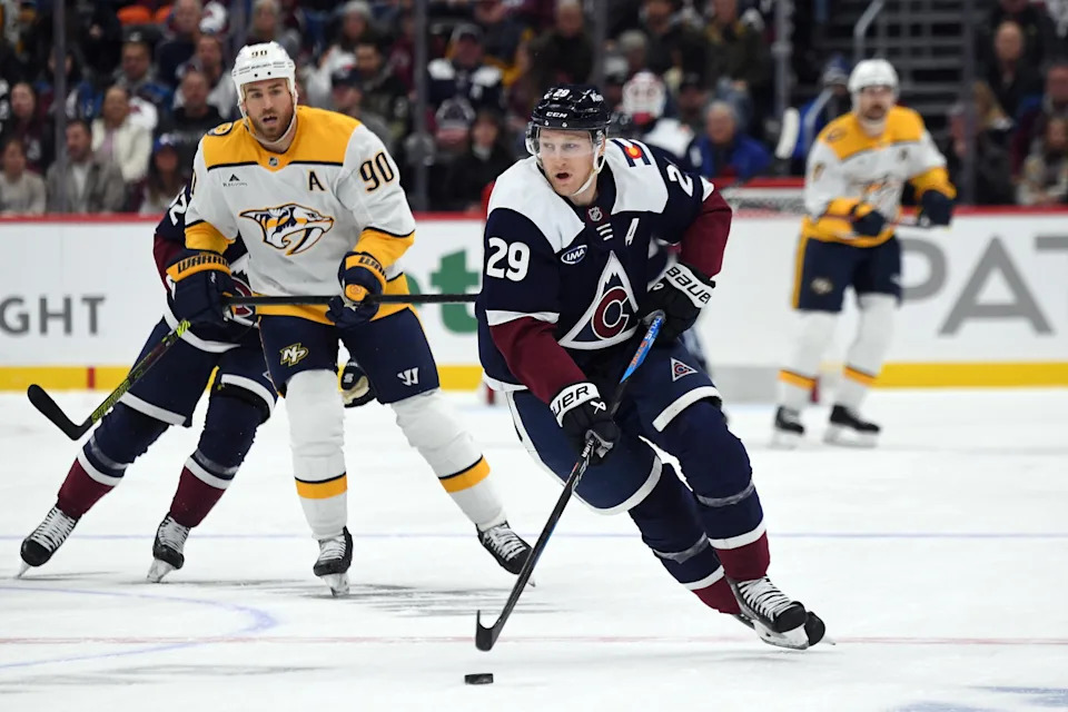 Nov 11, 2024; Denver, Colorado, USA; Colorado Avalanche center Nathan MacKinnon (29) skates the puck into the offensive zone during the second period against the Nashville Predators at Ball Arena. Mandatory Credit: Christopher Hanewinckel-Imagn Images