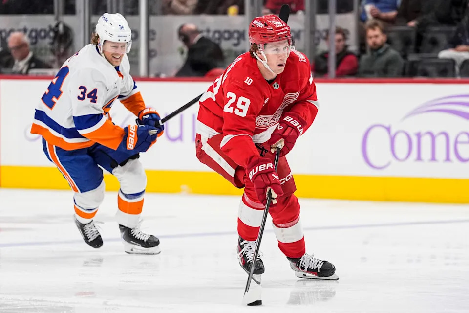 Detroit Red Wings center Nate Danielson (29) looks to shoot the puck against New York Islanders defenseman Adam Boqvist (34) during the third period at Little Caesars Arena in Detroit on Thursday, November 20, 2025.