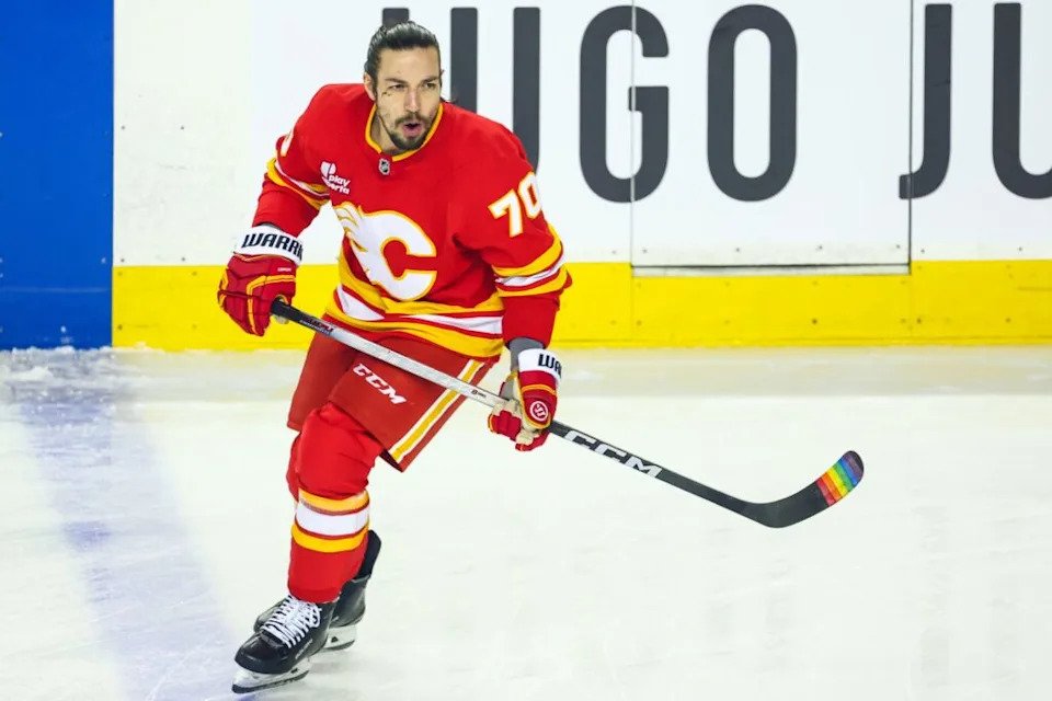 Jan 5, 2026; Calgary, Alberta, CAN; Calgary Flames left wing Ryan Lomberg (70) skates during the warmup period against the Seattle Kraken at Scotiabank Saddledome. Mandatory Credit: Sergei Belski-Imagn Images
