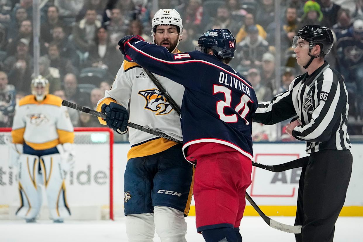Blue Jackets right wing Mathieu Olivier hits Predators defenseman Nicolas Hague on March 3.