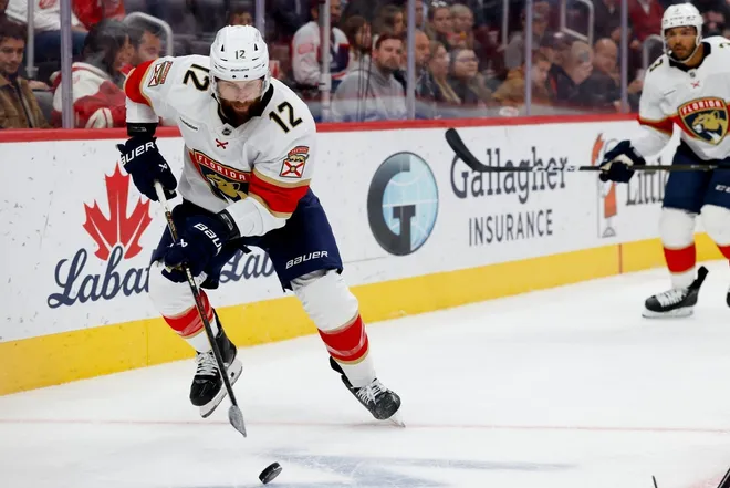 Oct 15, 2025; Detroit, Michigan, USA; Florida Panthers left wing Jonah Gadjovich (12) skates with the puck in the second period against the Detroit Red Wings at Little Caesars Arena.