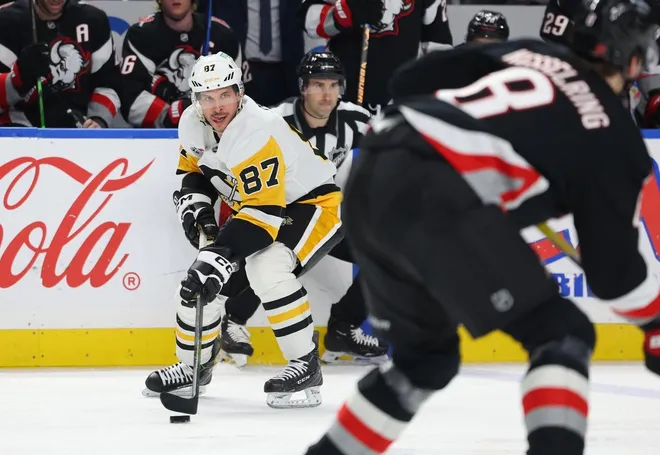Feb 5, 2026; Buffalo, New York, USA; Pittsburgh Penguins center Sidney Crosby (87) looks to make a pass during the third period against the Buffalo Sabres at KeyBank Center.