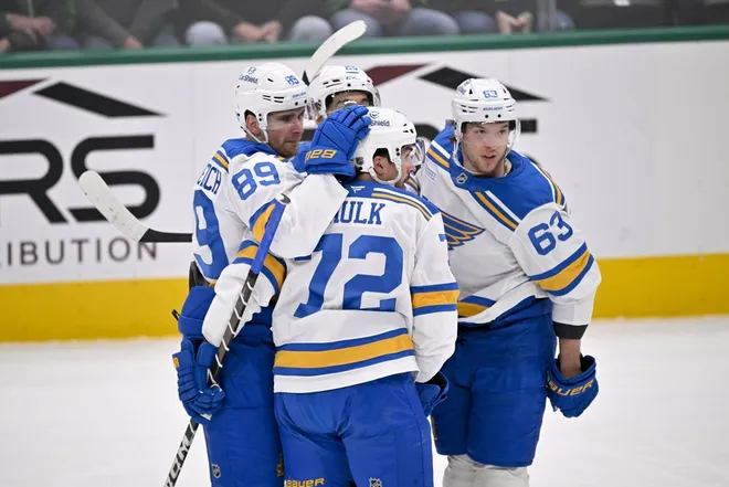 Feb 4, 2026; Dallas, Texas, USA; St. Louis Blues left wing Pavel Buchnevich (89) and defenseman Justin Faulk (72) and left wing Jake Neighbours (63) celebrates after Buchnevich scores a goal against the Dallas Stars during the first period at the American Airlines Center.