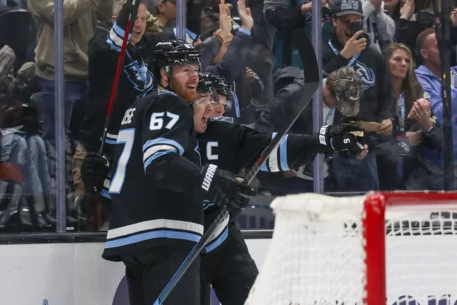 Feb 27, 2026; Salt Lake City, Utah, USA; Utah Mammoth left wing Lawson Crouse (67) celebrates scoring a goal against the Minnesota Wild with right wing Clayton Keller (9) during the second period at Delta Center.
