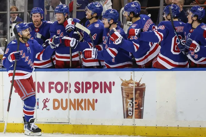 Feb 28, 2026; New York, New York, USA; New York Rangers center Vincent Trocheck (16) celebrates with his teammates after scoring a goal during a shootout against the Pittsburgh Penguins at Madison Square Garden.