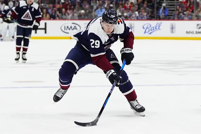 Feb 28, 2026; Denver, Colorado, USA; Colorado Avalanche center Nathan MacKinnon (29) controls the puck in the second period against the Chicago Blackhawks at Ball Arena.