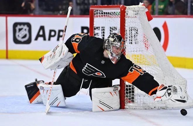 Mar 17, 2023; Philadelphia, Pennsylvania, USA; Philadelphia Flyers goalie Carter Hart (79) reaches for the puck against the Buffalo Sabres in the second period at Wells Fargo Center.