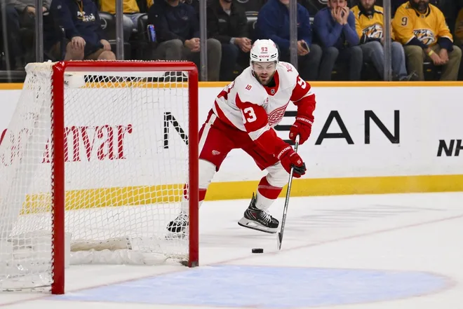 Mar 2, 2026; Nashville, Tennessee, USA; Detroit Red Wings right wing Alex DeBrincat (93) celebrates his goal on an empty net against the Nashville Predators during the third period at Bridgestone Arena.