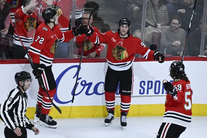 Mar 6, 2026; Chicago, Illinois, USA; Chicago Blackhawks center Frank Nazar (91) celebrates his goal against the Vancouver Canucks with defenseman Alex Vlasic (72) and left wing Tyler Bertuzzi (59) during the second period at United Center.