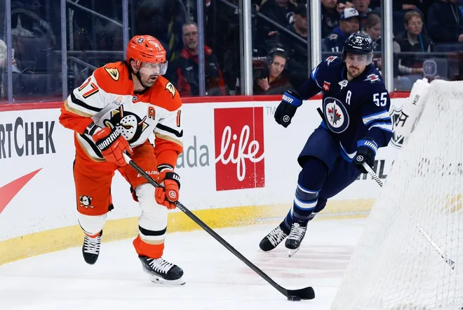 Mar 10, 2026; Winnipeg, Manitoba, CAN; Anaheim Ducks forward Alex Killorn (17) skates away from Winnipeg Jets forward Mark Scheifele (55) during the third period at Canada Life Centre.