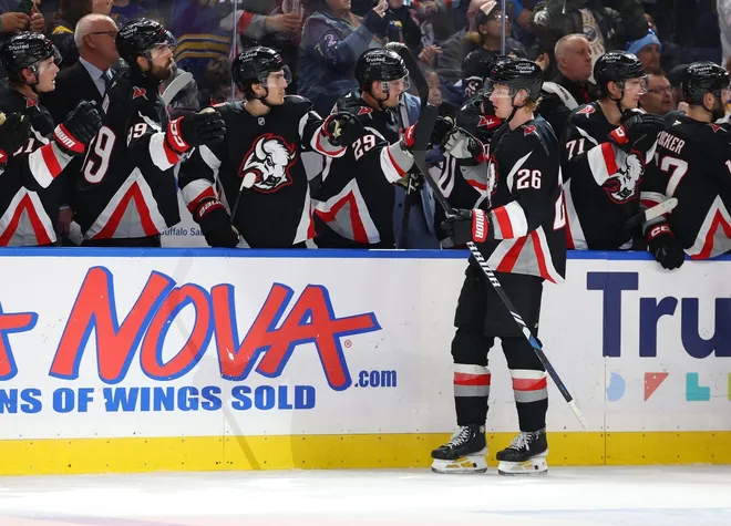 Mar 8, 2026; Buffalo, New York, USA; Buffalo Sabres defenseman Rasmus Dahlin (26) celebrates his goal with teammates during the third period against the Tampa Bay Lightning at KeyBank Center.