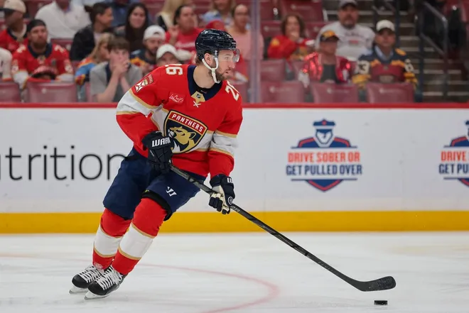 Feb 27, 2026; Sunrise, Florida, USA; Florida Panthers defenseman Uvis Balinskis (26) moves the puck against the Buffalo Sabres during the first period at Amerant Bank Arena.