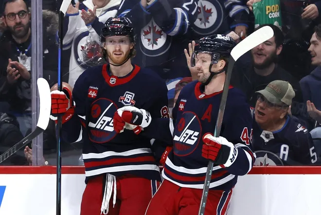 Mar 14, 2026; Winnipeg, Manitoba, CAN; Winnipeg Jets left wing Kyle Connor (81) celebrates his goal against the Colorado Avalanche in the second period with Winnipeg Jets defenseman Josh Morrissey (44) at Canada Life Centre.
