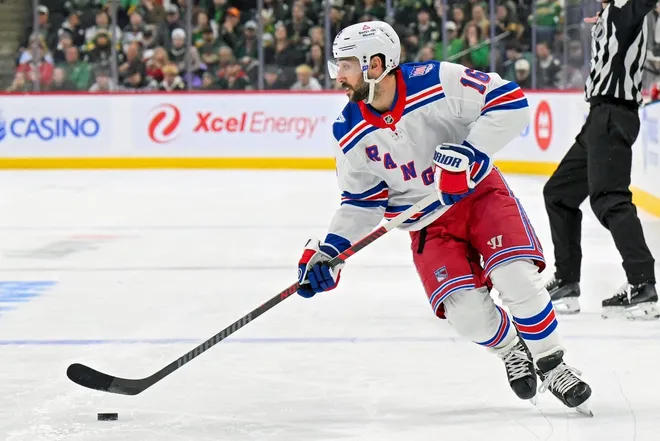 Mar 14, 2026; Saint Paul, Minnesota, USA; New York Rangers forward Vincent Trocheck (16) controls the puck against the Minnesota Wild during the third period at Grand Casino Arena.