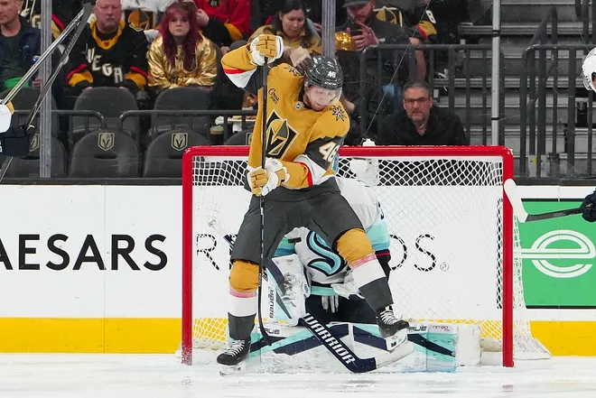 Jan 31, 2026; Las Vegas, Nevada, USA; Vegas Golden Knights right wing Jonas Rondbjerg (46) screens Seattle Kraken goaltender Joey Daccord (35) as a shot comes towards the net during the second period at T-Mobile Arena.