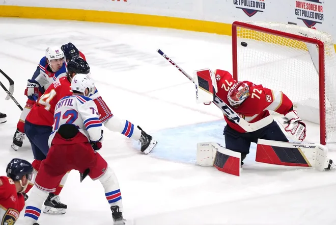Dec 30, 2024; Sunrise, Florida, USA; Florida Panthers goaltender Sergei Bobrovsky (72) deflects a shot by New York Rangers center Filip Chytil (72) over the crossbar during the third period at Amerant Bank Arena.