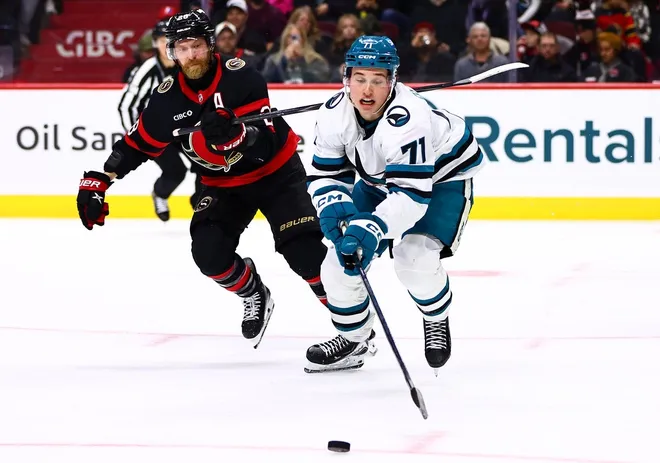 Mar 15, 2026; Ottawa, Ontario, CAN; San Jose Sharks center Macklin Celebrini (71) skates for the puck as Ottawa Senators right wing Claude Giroux (28) chases during the second period at Canadian Tire Centre.