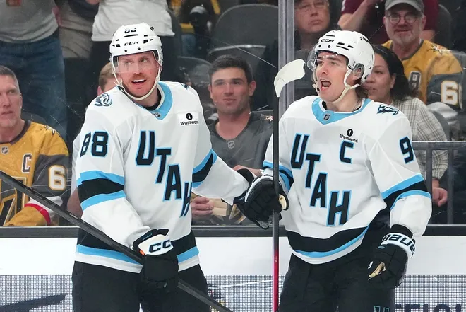 Mar 19, 2026; Las Vegas, Nevada, USA; Utah Mammoth right wing Clayton Keller (9) celebrates with defenseman Nate Schmidt (88) after scoring a goal against the Vegas Golden Knights during the first period at T-Mobile Arena.