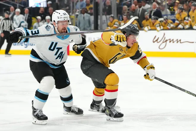 Mar 19, 2026; Las Vegas, Nevada, USA; Vegas Golden Knights right wing Mitch Marner (93) skates ahead of Utah Mammoth left wing Michael Carcone (53) during the third period at T-Mobile Arena.