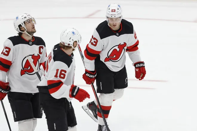 Mar 20, 2026; Washington, District of Columbia, USA; New Jersey Devils left wing Jesper Bratt (63) celebrates with teammates after scoring a goal against the Washington Capitals during the third period at Capital One Arena.