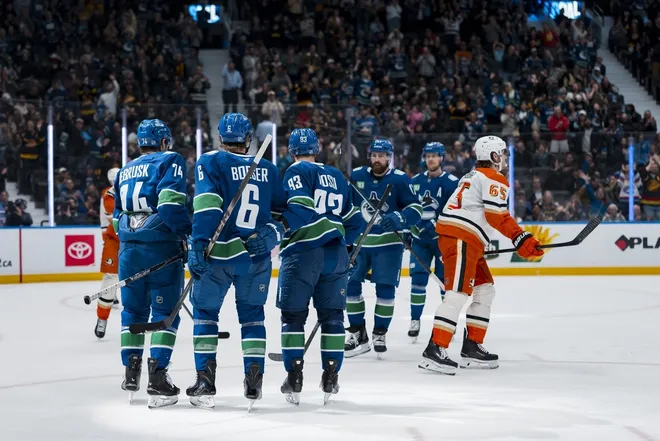 Mar 24, 2026; Vancouver, British Columbia, CAN; Vancouver Canucks forward Jake DeBrusk (74) and forward Brock Boeser (6) and forward Marco Rossi (93) and defenseman Filip Hronek (17) and forward Elias Pettersson (40) celebrate Boeser’s goal against the Anaheim Ducks in the second period at Rogers Arena.