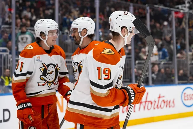 Mar 24, 2026; Vancouver, British Columbia, CAN; Anaheim Ducks forward Leo Carlsson (91) and Anaheim Ducks forward Chris Kreider (20)and forward Troy Terry (19) celebrate Terry’s goal against the Vancouver Canucks in the third period at Rogers Arena.