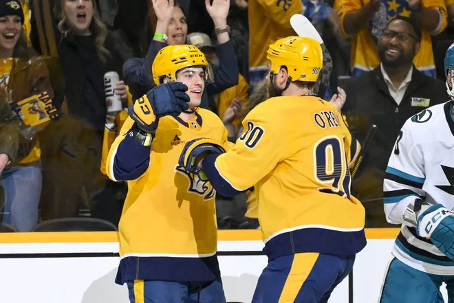Mar 24, 2026; Nashville, Tennessee, USA; Nashville Predators right wing Luke Evangelista (77) celebrates his goal with center Ryan O'Reilly (90) against the San Jose Sharks during the first period at Bridgestone Arena.
