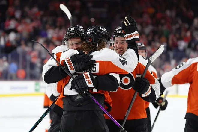 Mar 29, 2026; Philadelphia, Pennsylvania, USA; Philadelphia Flyers center Trevor Zegras (46) celebrates with right wing Owen Tippett (74) after scoring a goal against the Dallas Stars in overtime at Xfinity Mobile Arena.