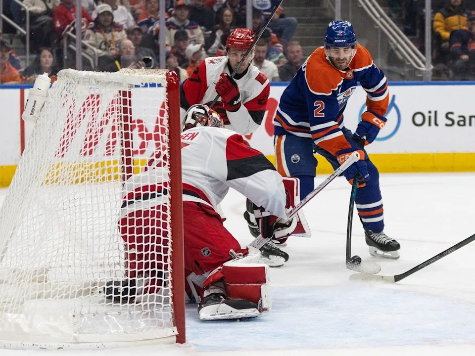  Carolina Hurricanes goalie Frederik Andersen (31) makes a save on Edmonton Oilers’ Evan Bouchard (2) as Nikolaj Ehlers (27) chases during second period NHL action, in Edmonton on Friday March 6, 2026.