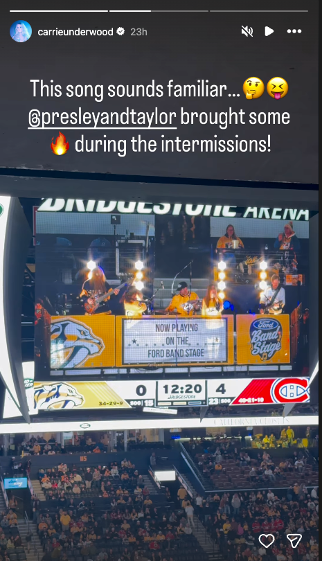 Concert performance on an arena stage during a sports event.