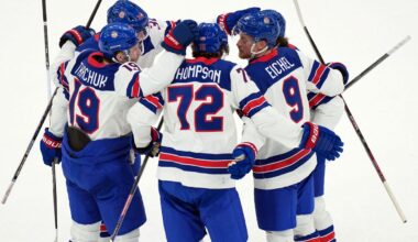 United States' Tage Thompson (72) celebrates with Matthew Tkachuk (19) and Jack Eichel (9) after Thompson scored against Slovakia during the first period of a men's ice hockey semifinal game at the 2026 Winter Olympics in Milan, Italy, Friday, Feb. 20, 2026. (AP Photo/Carolyn Kaster)