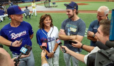 Texas Rangers' Nathaniel Lowe, left, and Tampa Bay Rays' Josh Lowe, third from left, talk to the media along with their parents Wendy Lowe, second from left, and David Lowe, back right, prior to a baseball game June 9, 2023, in St. Petersburg, Fla. (AP Photo/Mike Carlson, File)