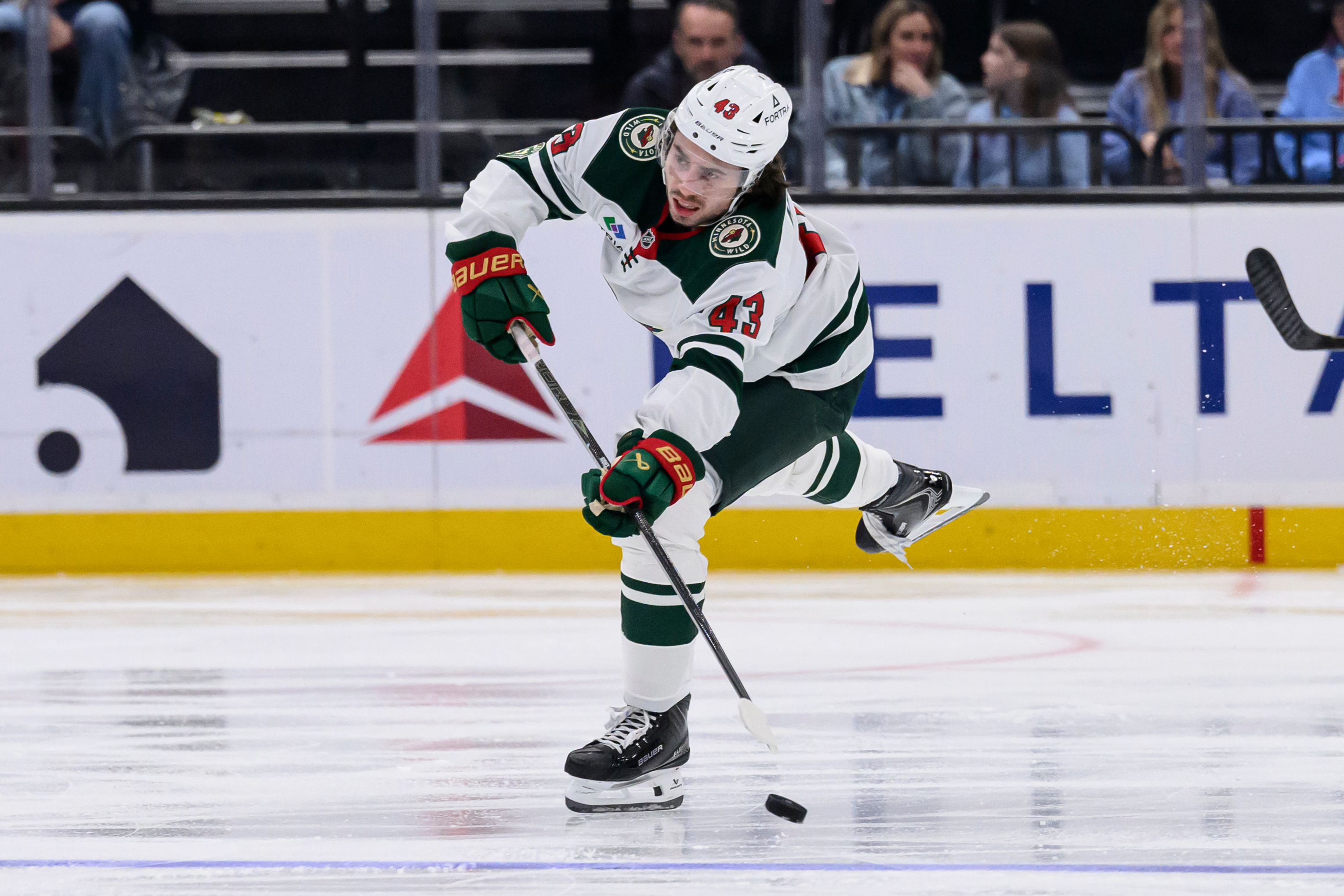 Minnesota Wild defenseman Quinn Hughes passes the puck during the second period of an NHL hockey game against the Utah Mammoth, Friday, Feb. 27, 2026, in Salt Lake City. (AP Photo/Tyler Tate)