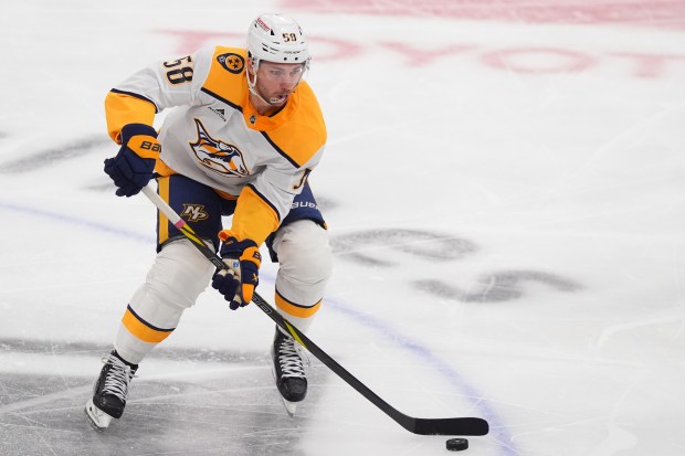 Nashville Predators left wing Michael Bunting (58) skates with the puck during the third period of an NHL hockey game against the Dallas Stars Saturday, Feb. 28, 2026, in Dallas. (AP Photo/LM Otero)