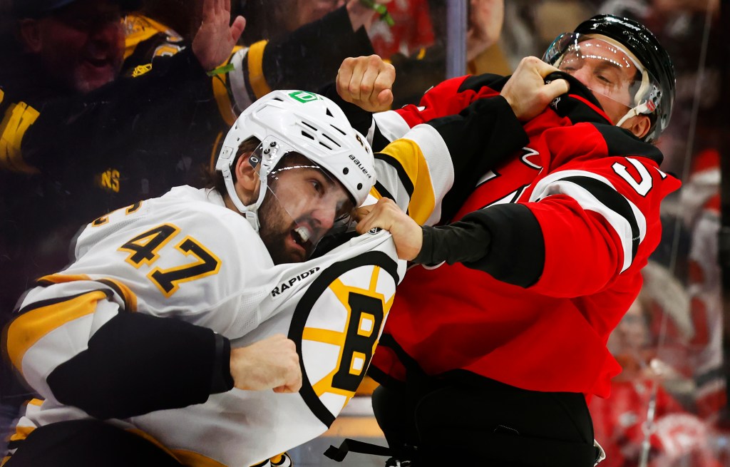Bruins blow two-goal lead, lose to Devils in wild OT
