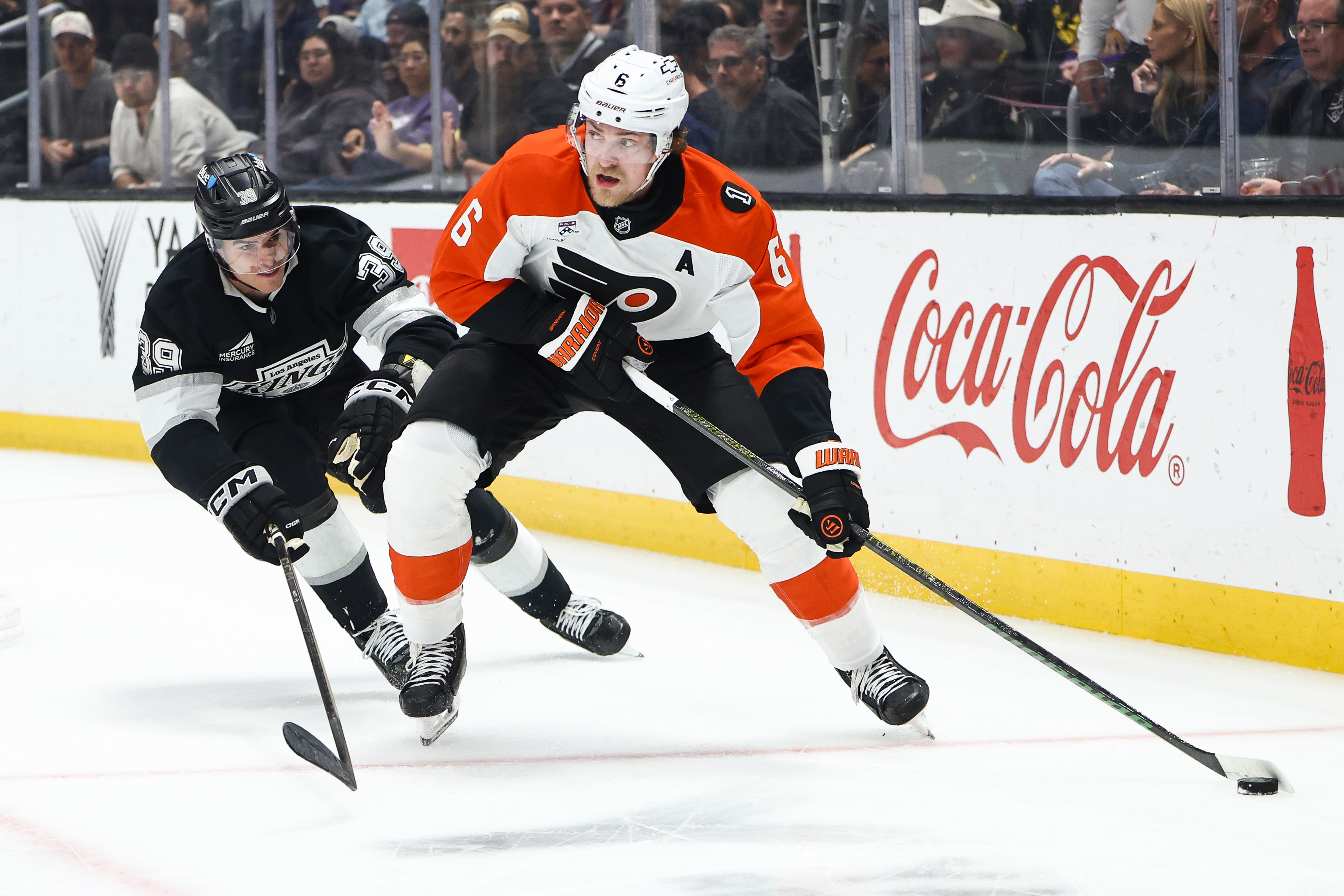 Philadelphia Flyers defenseman Travis Sanheim (6) skates with the puck...