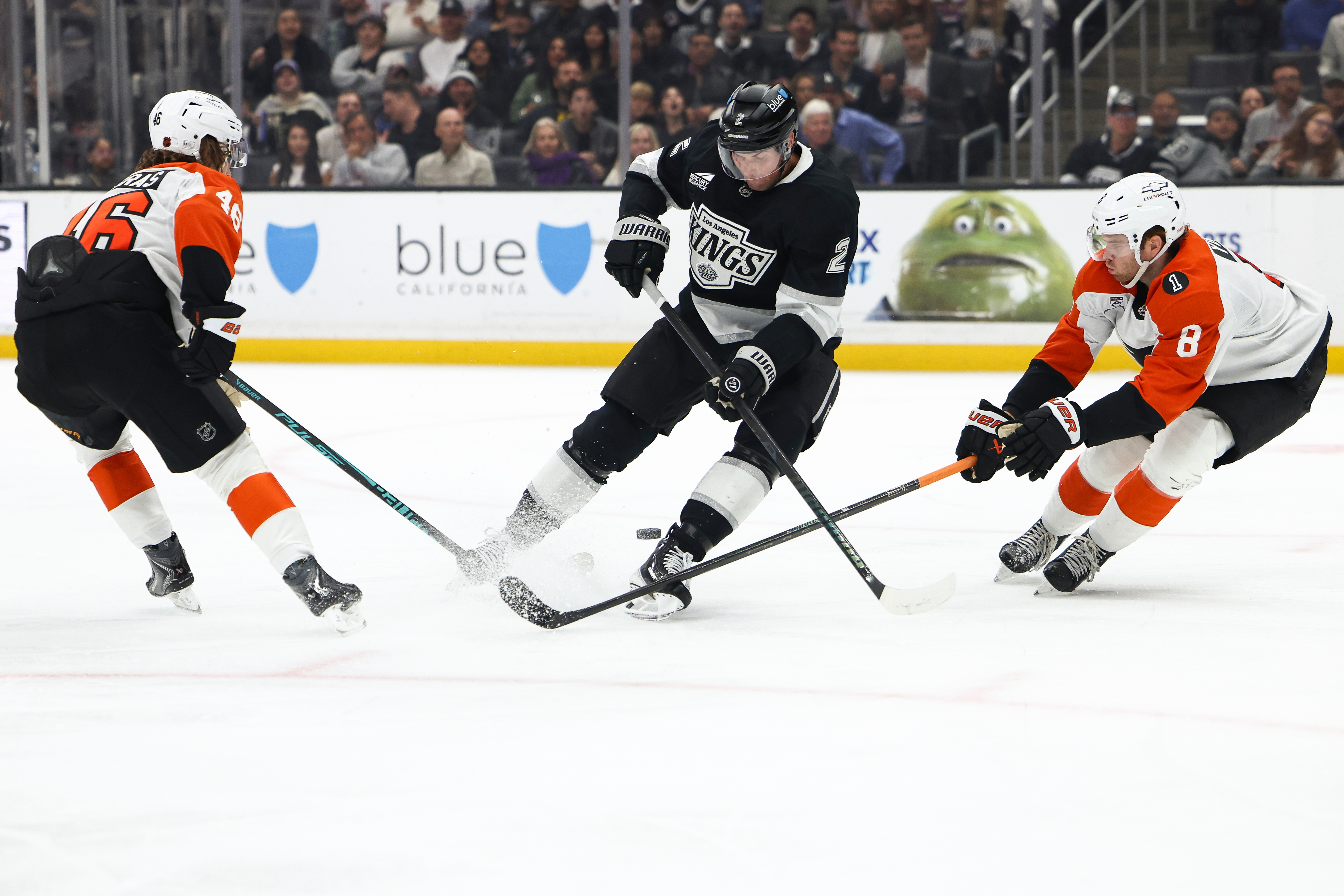 Kings defenseman Brian Dumoulin (2) skates with the puck against...