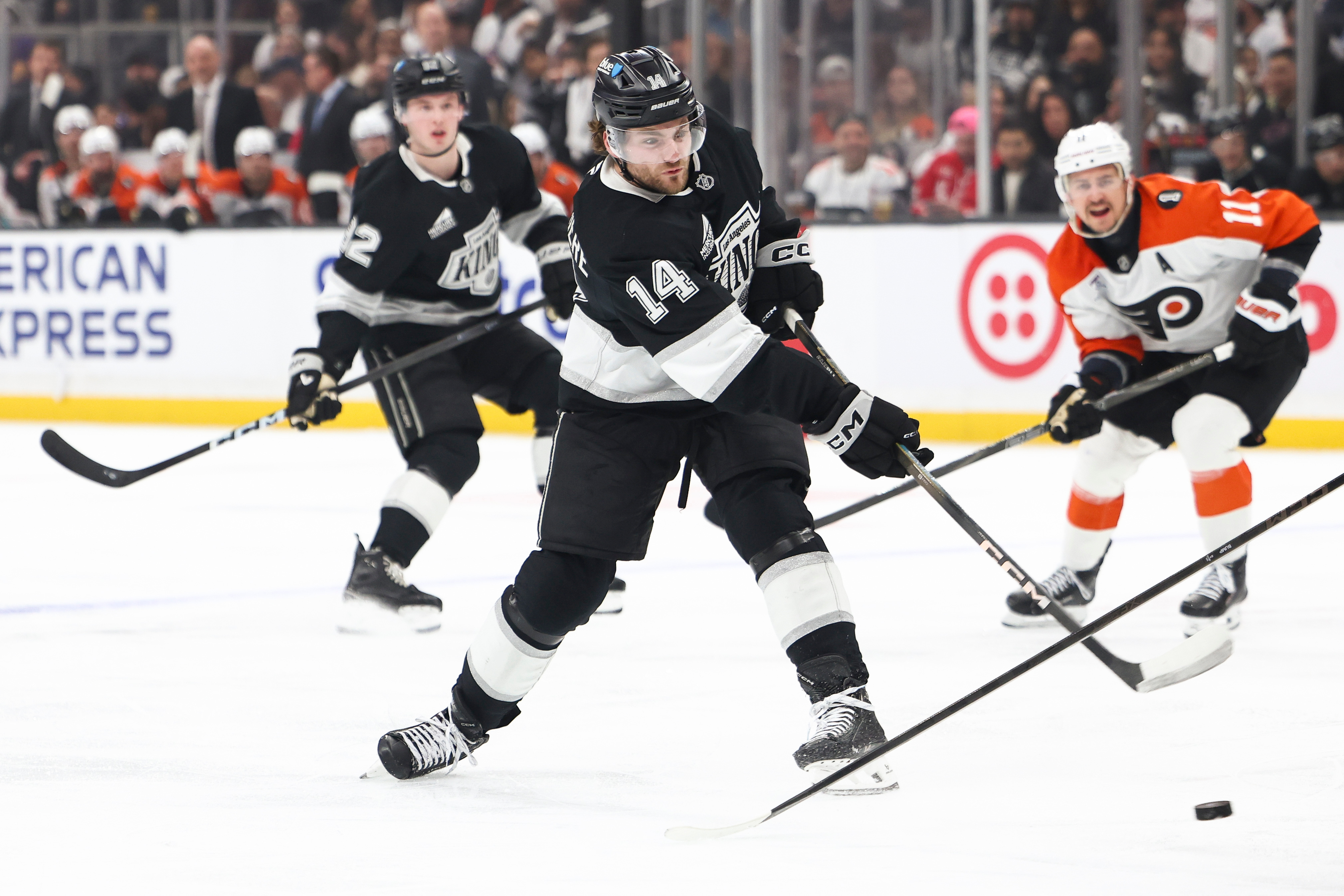 Kings right wing Alex Laferriere (14) shoots as defenseman Brandt...
