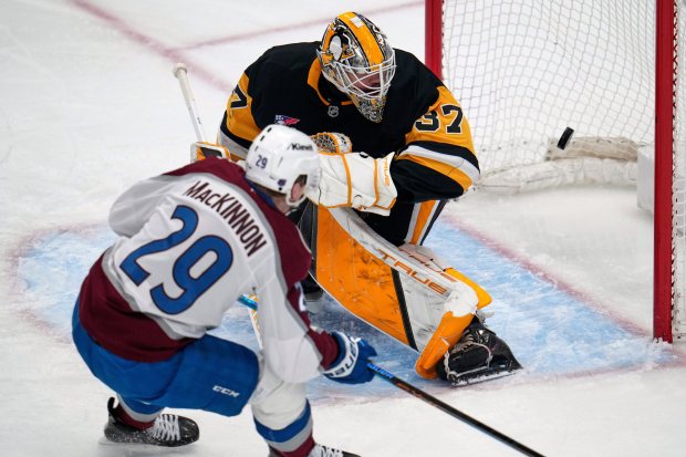 Colorado Avalanche's Nathan MacKinnon (29) puts a shot behind Pittsburgh Penguins goaltender Arturs Silovs (37) for a goal during the first period of an NHL hockey game in Pittsburgh, Tuesday, March 24, 2026. (AP Photo/Gene J. Puskar)