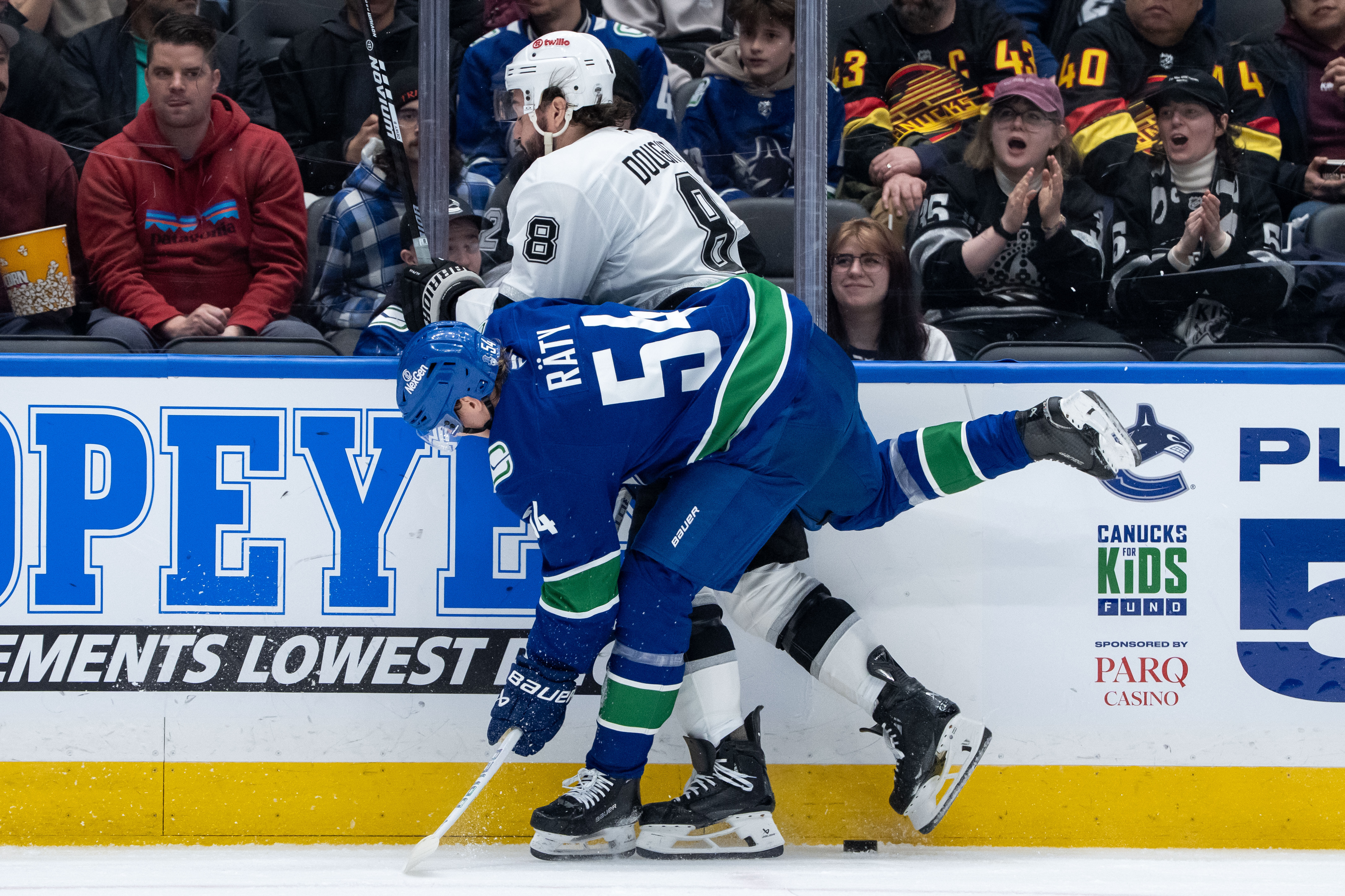 The Vancouver Canucks’ Aatu Raty (54) hits Kings defenseman Drew...