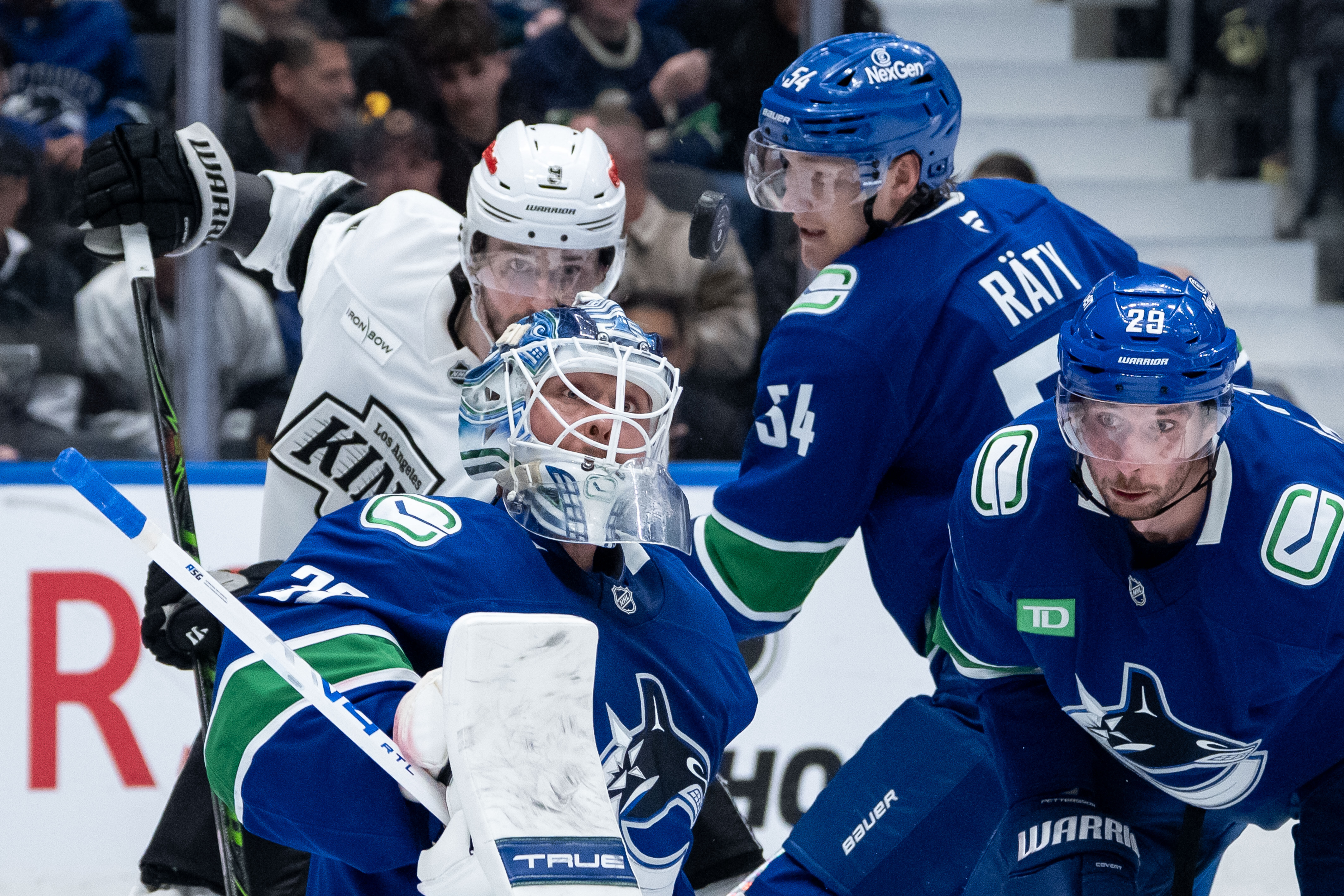 Vancouver Canucks goaltender Kevin Lankinen (32), Aatu Raty (54), Marcus...