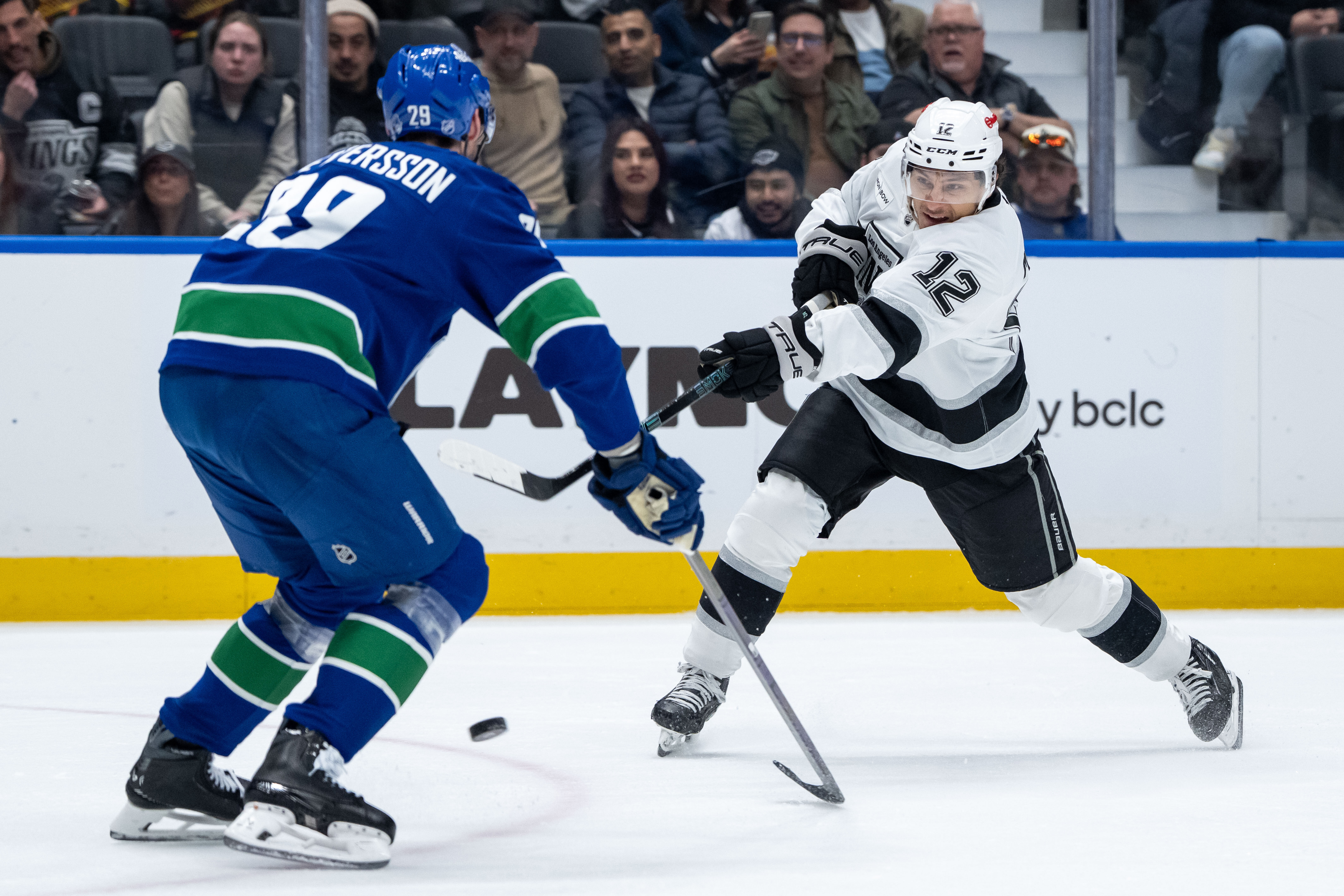 The Kings’ Trevor Moore (12) shoots as the Vancouver Canucks’...
