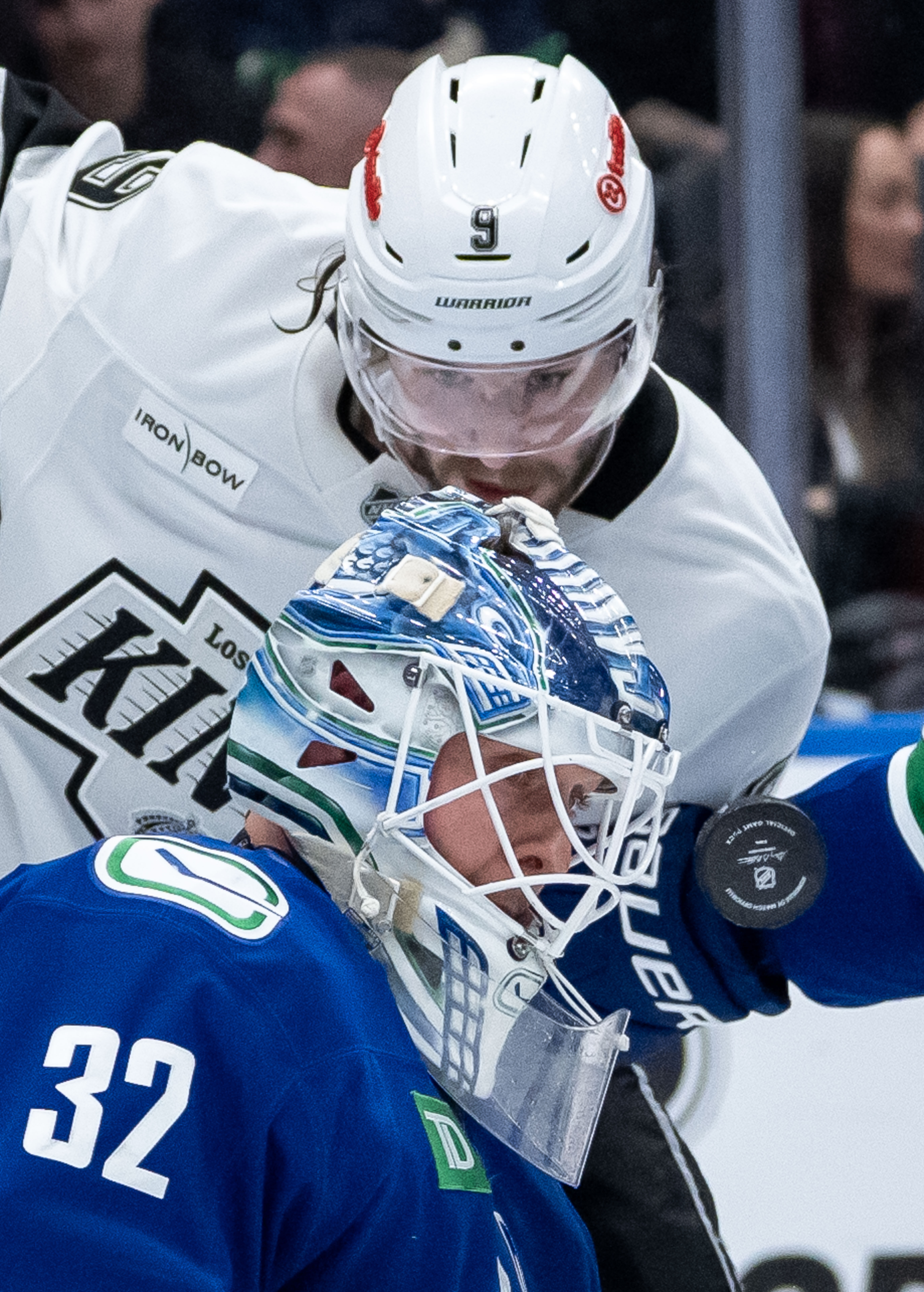 Vancouver Canucks goaltender Kevin Lankinen, bottom, and the Kings’ Adrian...