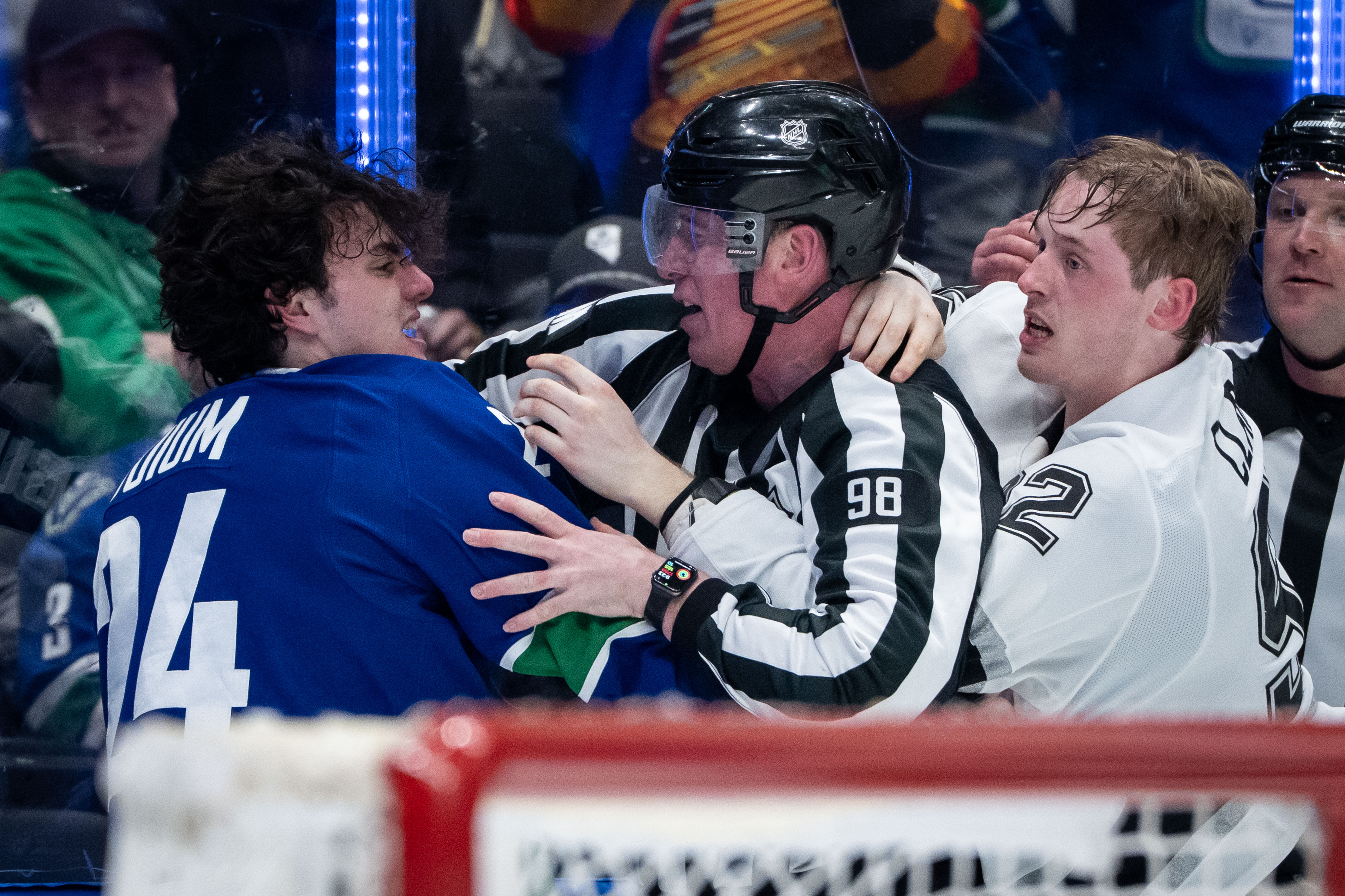 The Vancouver Canucks’ Zeev Buium, left, and the Kings’ Brandt...