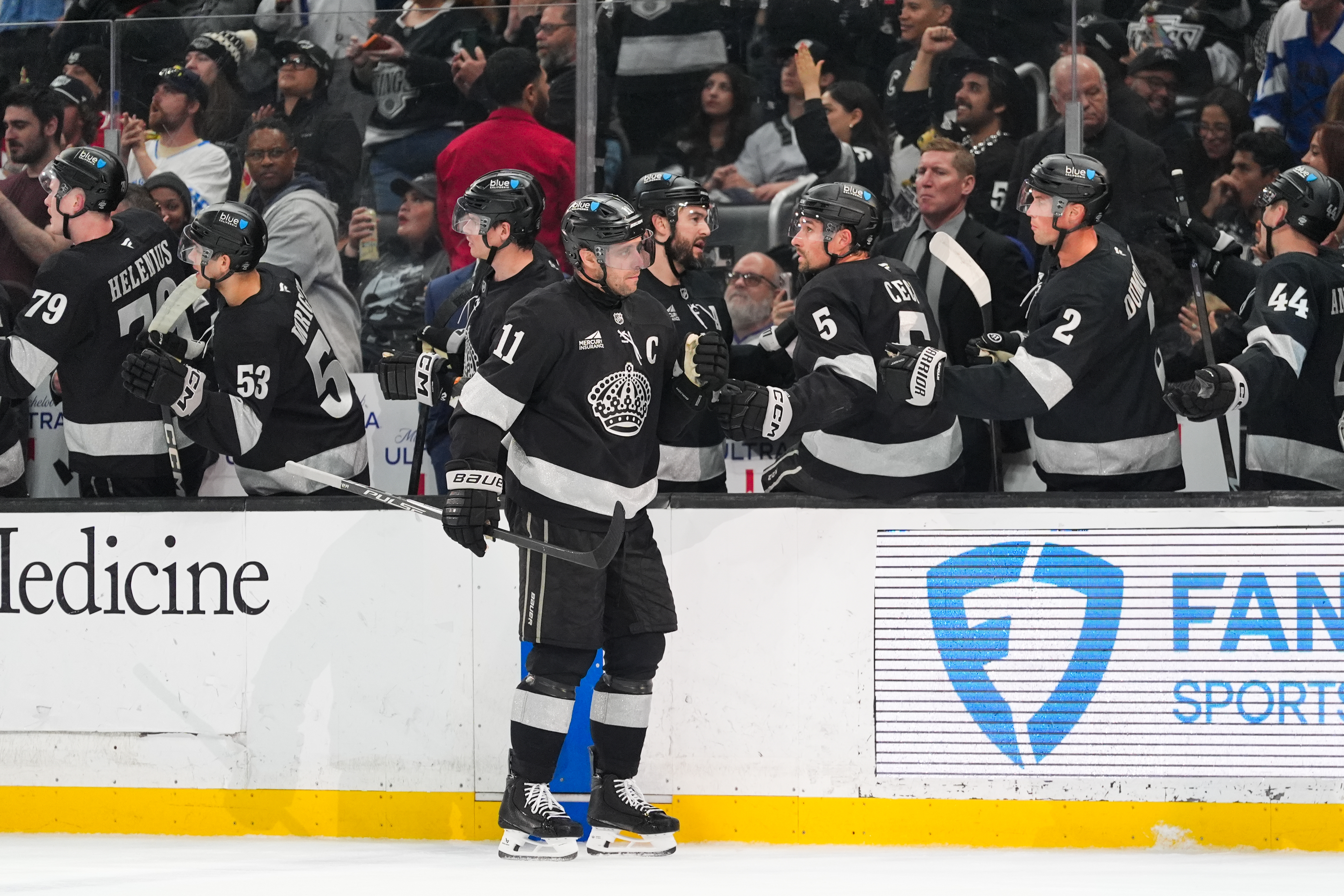 Kings center Anze Kopitar (11) celebrates his goal with teammates...