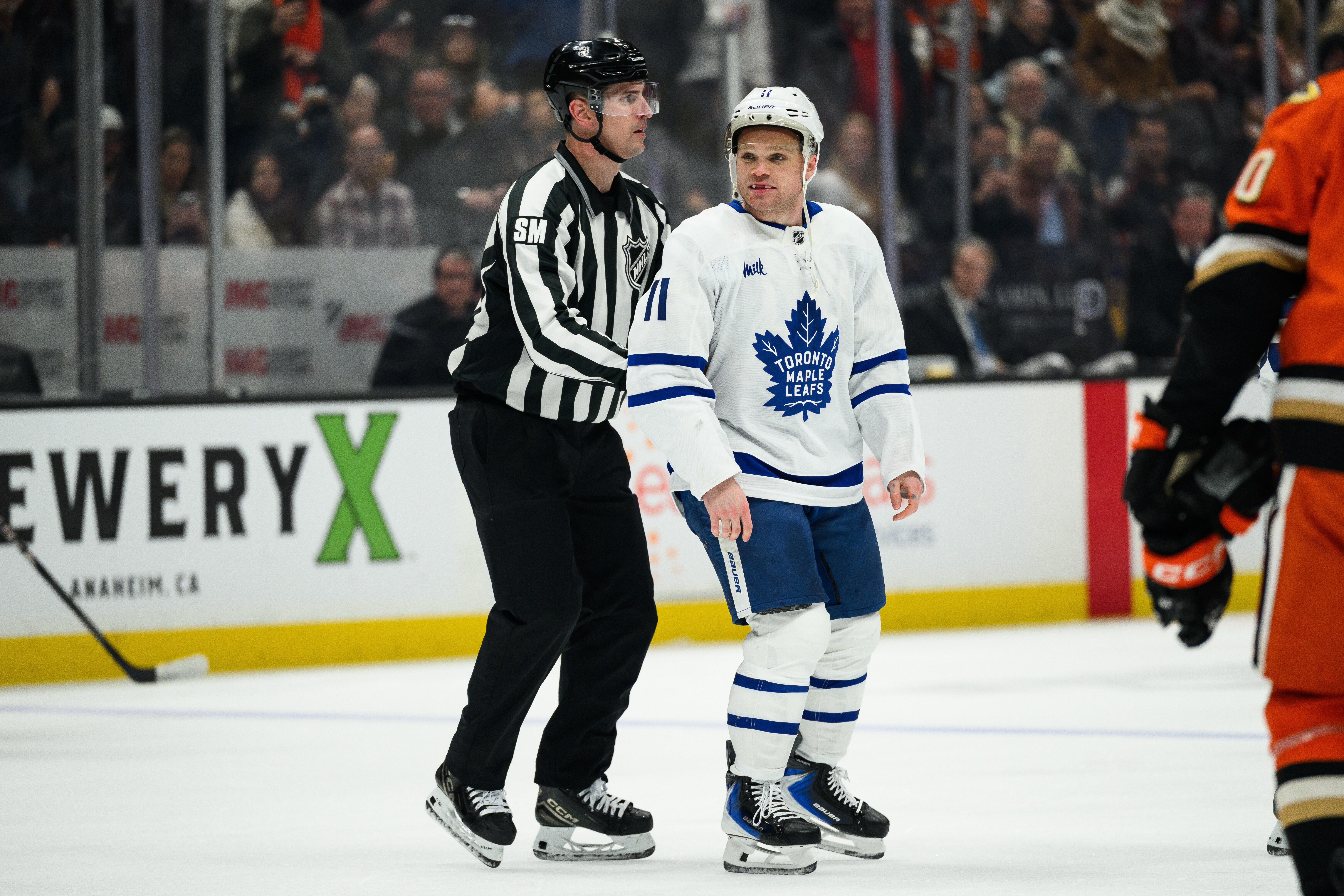 Toronto Maple Leafs center Max Domi is escorted off the...