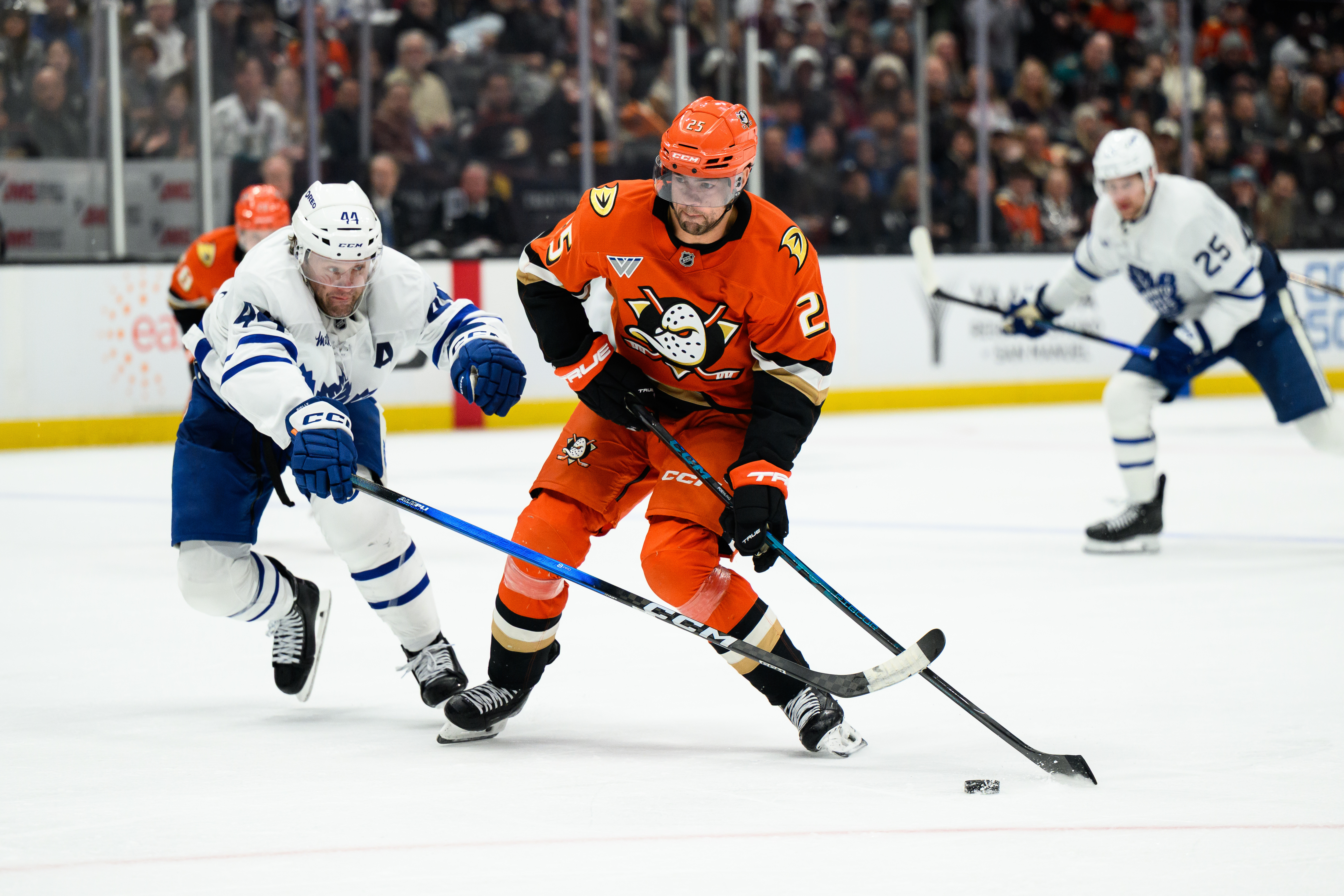 Ducks center Ryan Poehling, right, and Toronto Maple Leafs defenseman...