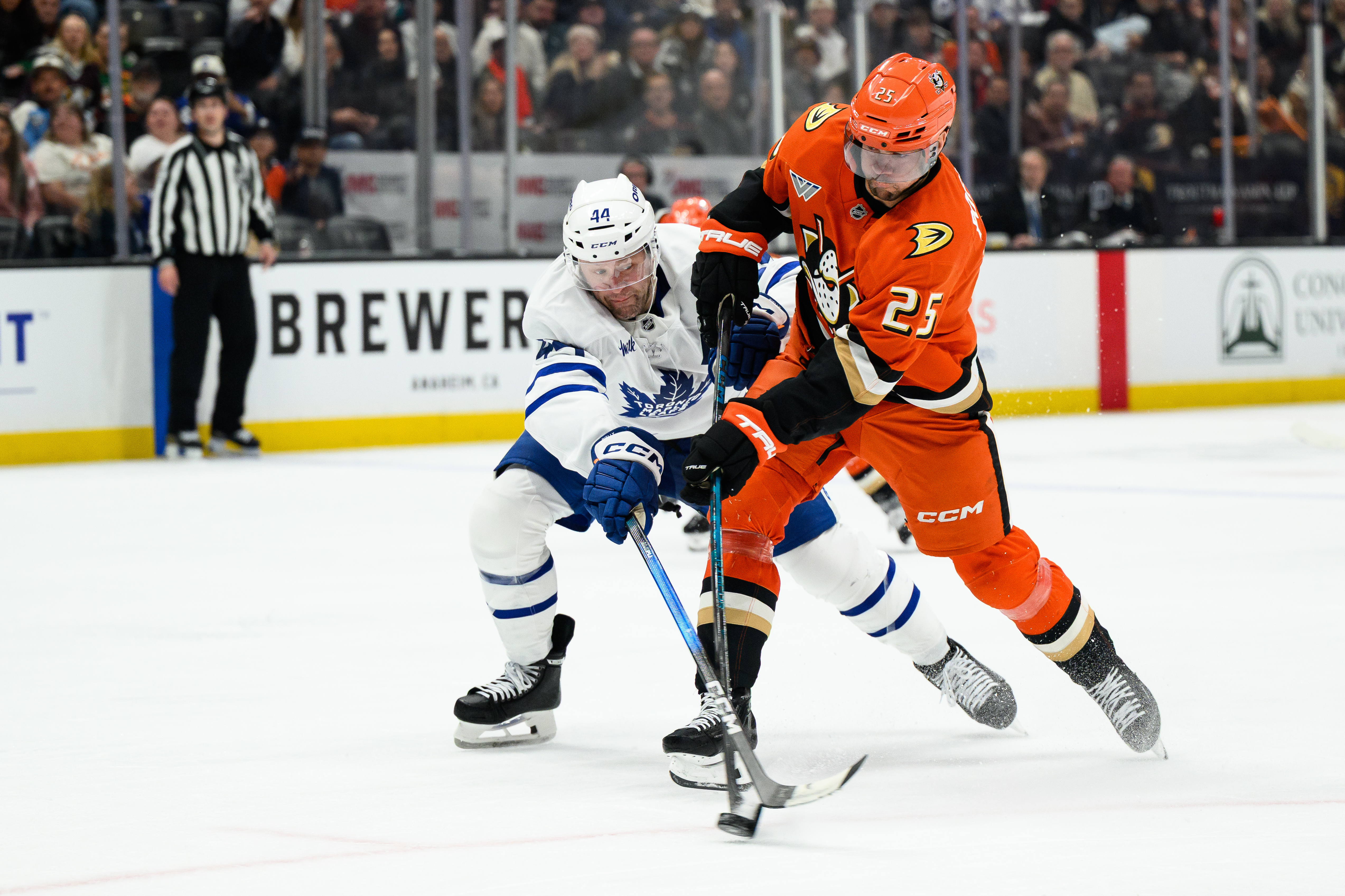 Ducks center Ryan Poehling, right, and Toronto Maple Leafs defenseman...