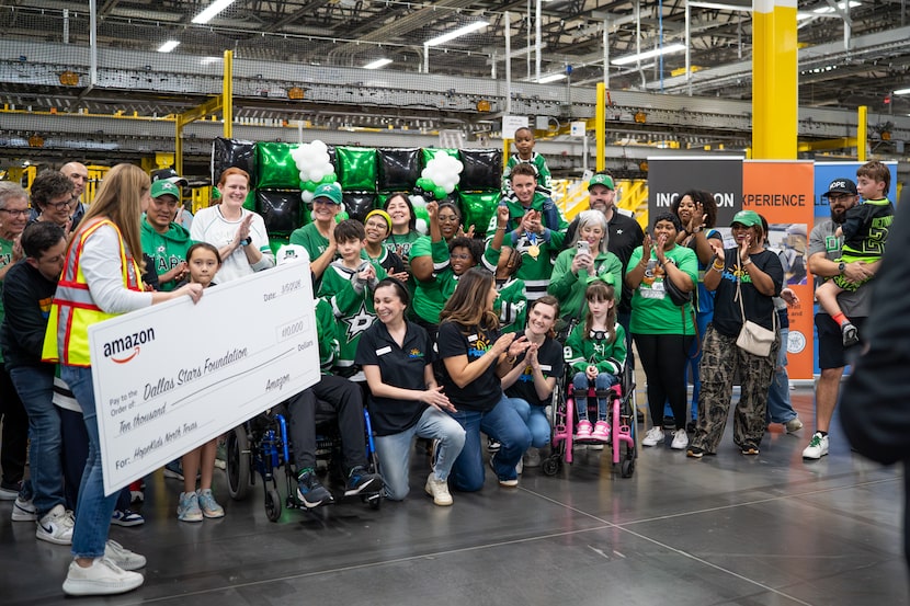 Dallas Stars goalie Jake Oettinger celebrates with HopeKids families as Amazon donates...