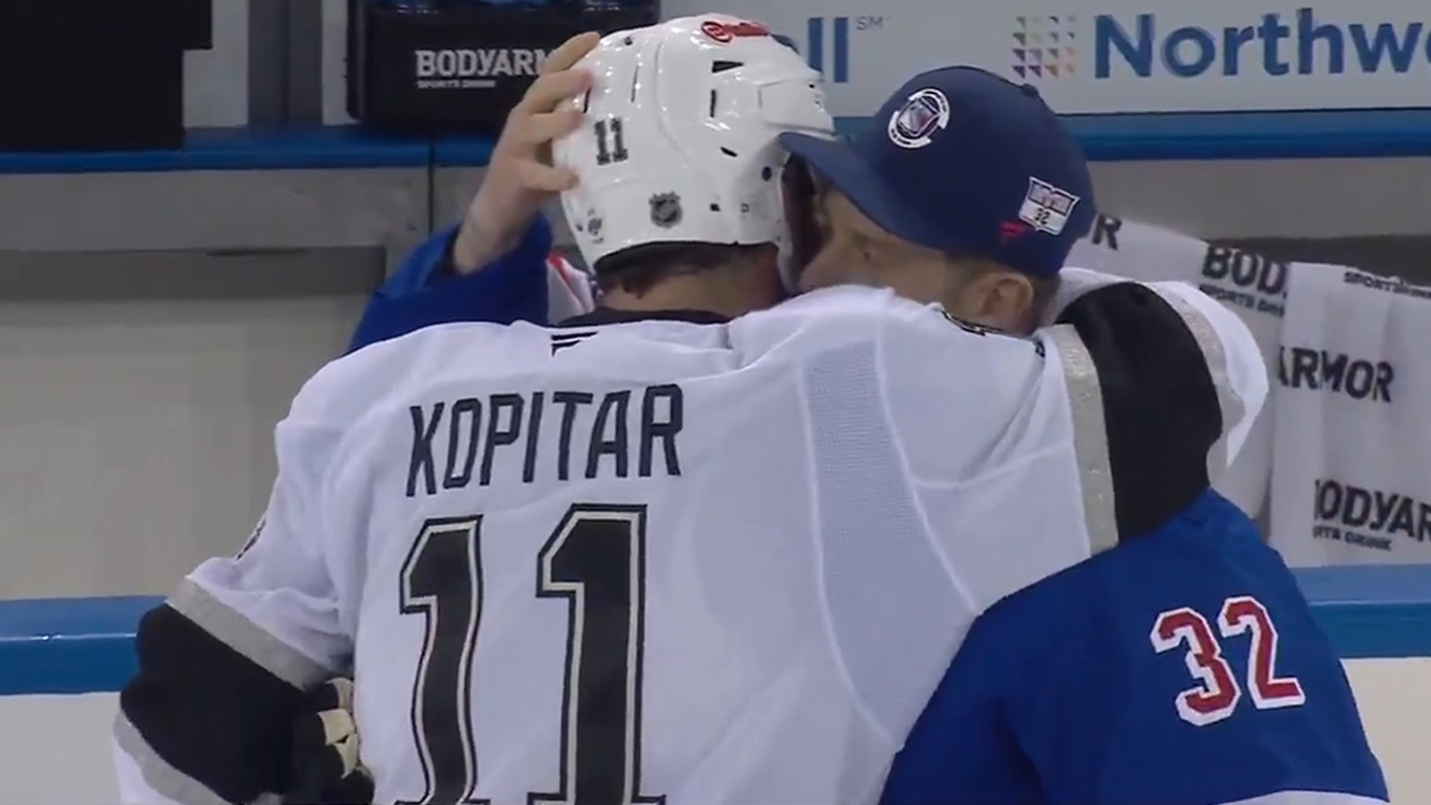 Anze Kopitar and Jonathan hugging after a game